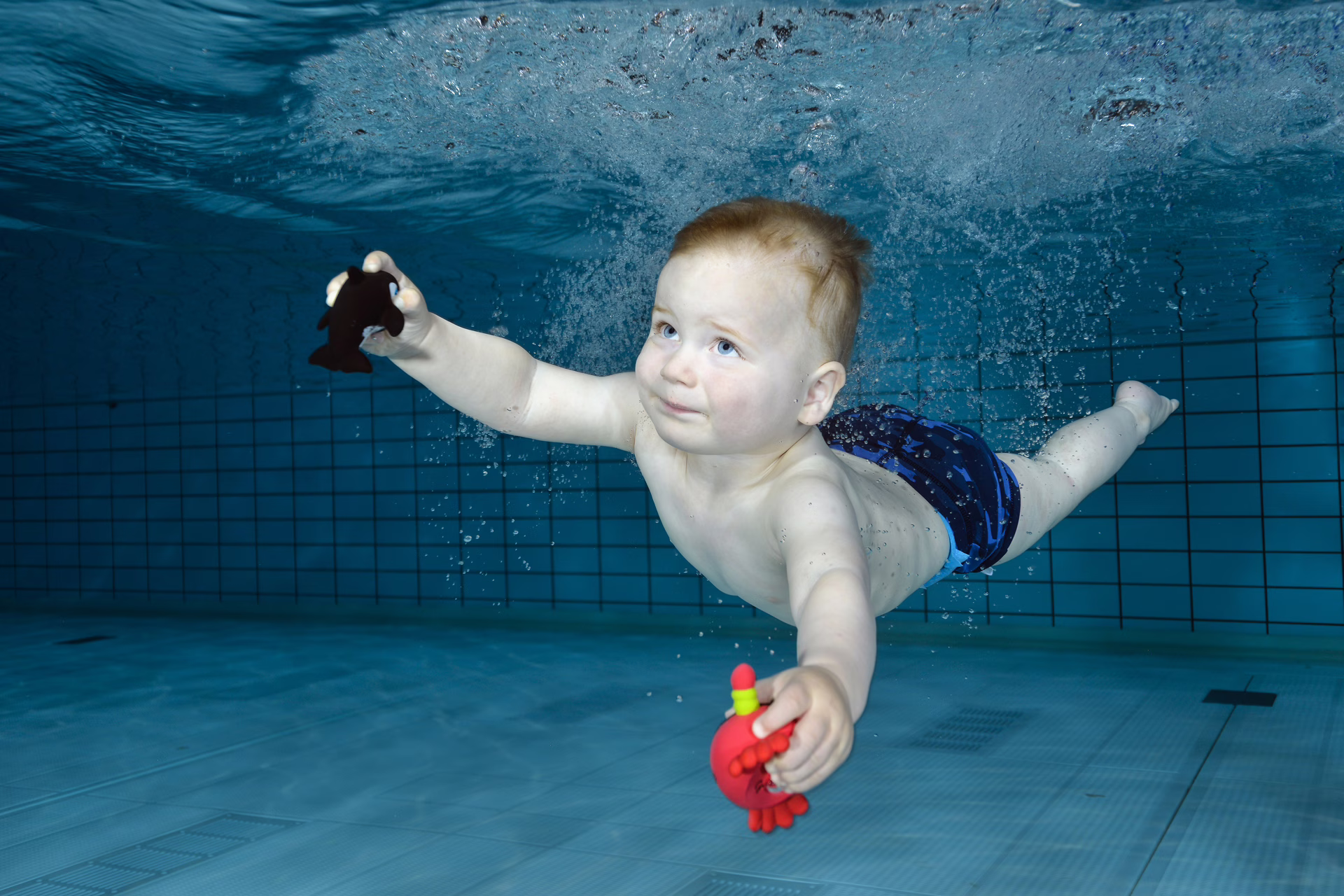 Onderwaterfotografie, ouder en kindzwemmen. Foto info@wetpics.nl Erika Antoniazzo